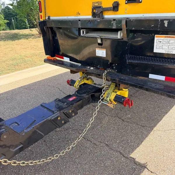 Underlift secured under the rear of a box truck